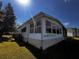 Sunroom with brick foundation and sliding windows to enjoy the outdoor view at 2055 S Floral Ave # 73, Bartow, FL 33830