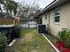 Backyard with wooden fence, AC unit and garden at 2062 Katie Ct, Winter Haven, FL 33884