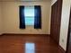 Bedroom with hardwood floors and double closets at 2062 Katie Ct, Winter Haven, FL 33884