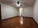 Spacious bedroom with hardwood floors and ceiling fan at 2062 Katie Ct, Winter Haven, FL 33884