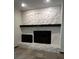 Stone fireplace with a modern mantel in the living room at 2062 Katie Ct, Winter Haven, FL 33884