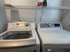 Laundry room with LG washer and dryer, and shelving at 2062 Katie Ct, Winter Haven, FL 33884