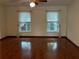 Bright living room featuring hardwood floors and ample natural light at 2062 Katie Ct, Winter Haven, FL 33884