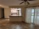 Open living area with kitchen island and access to the backyard at 2062 Katie Ct, Winter Haven, FL 33884