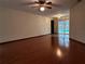 Living area with hardwood floors, view of pool at 2062 Katie Ct, Winter Haven, FL 33884