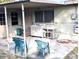 Small back patio with sink and two chairs at 217 Bay E St, Davenport, FL 33837