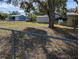 Large backyard with storage shed and chain link fence at 217 Bay E St, Davenport, FL 33837