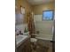 Bathroom with shower/tub combo and wood vanity at 217 Bay E St, Davenport, FL 33837