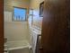 Clean bathroom with a tub and shower at 217 Bay E St, Davenport, FL 33837