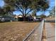 Single story house with carport and fenced yard at 217 Bay E St, Davenport, FL 33837