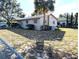 House exterior with palm tree and chain link fence at 217 Bay E St, Davenport, FL 33837