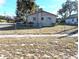 Single story house with a metal roof and fenced yard at 217 Bay E St, Davenport, FL 33837