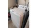 White washer and dryer in a compact laundry room at 217 Bay E St, Davenport, FL 33837