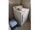 White dryer in a compact laundry room at 217 Bay E St, Davenport, FL 33837