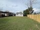 Large backyard with a wood fence at 3445 Avenue F Nw, Winter Haven, FL 33881