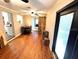 The dining area features hardwood floors and rustic barn door to kitchen at 3445 Avenue F Nw, Winter Haven, FL 33880