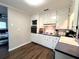 Galley style kitchen with white cabinets and stainless steel appliances at 3445 Avenue F Nw, Winter Haven, FL 33881