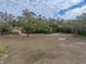 Spacious backyard with shed and lush trees at 3703 White Oak Ct, Lake Wales, FL 33898