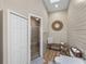 Clean bathroom featuring a shower, toilet, and linen storage at 3703 White Oak Ct, Lake Wales, FL 33898