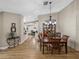 Dining area with wood floor, lighting, and hutch at 3703 White Oak Ct, Lake Wales, FL 33898