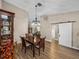 Dining room with wood floor, barn door, and hutch at 3703 White Oak Ct, Lake Wales, FL 33898