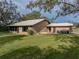 Brick house with a metal roof and a large backyard at 3703 White Oak Ct, Lake Wales, FL 33898