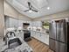 Updated kitchen featuring white cabinets and granite countertops at 3703 White Oak Ct, Lake Wales, FL 33898