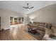 Relaxing living room with sectional sofa, coffee table and ceiling fan at 3703 White Oak Ct, Lake Wales, FL 33898