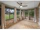 Sunroom featuring brick walls, herringbone flooring, and multiple windows offering natural light at 3703 White Oak Ct, Lake Wales, FL 33898