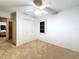 Spacious bedroom featuring carpet flooring, ceiling fan, window and closet at 41 Spring Ln, Haines City, FL 33844