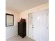 Welcoming entryway with neutral tones, a decorative mirror, and a storage chest at 41 Spring Ln, Haines City, FL 33844