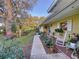 Cozy front porch with inviting seating and views of the landscaped garden at 41 Spring Ln, Haines City, FL 33844