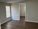 Bedroom with wood look laminate flooring, neutral paint and a window at 4128 W Bella Vista St, Lakeland, FL 33810