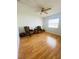 Comfortable bedroom with hardwood floors, window, and stylish chairs at 419 Broward Ter, Winter Haven, FL 33884