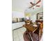 Dining area adjacent to kitchen showcasing tile floors at 419 Broward Ter, Winter Haven, FL 33884