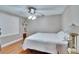 Bedroom showcasing a ceiling fan, wood floors, and soft, neutral colors at 4523 Hallamview Ln, Lakeland, FL 33813