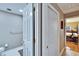 Hallway featuring closet, bathroom entrance, and access to a bedroom at 4523 Hallamview Ln, Lakeland, FL 33813