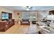 Cozy living room featuring hardwood floors, and large windows for plenty of natural light at 4523 Hallamview Ln, Lakeland, FL 33813