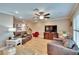 Comfortable living room with hardwood floors, neutral paint, ceiling fan and natural light at 4523 Hallamview Ln, Lakeland, FL 33813