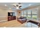 Cozy living room with a ceiling fan, plantation shutters and comfortable seating at 4523 Hallamview Ln, Lakeland, FL 33813