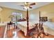 Comfortable main bedroom with ceiling fan and hardwood floors at 4523 Hallamview Ln, Lakeland, FL 33813