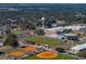 Aerial view of school campus, football field, and track at 465 Rowland Ct, Bartow, FL 33830