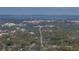 Aerial view showcasing a town's streets and waterfront at 465 Rowland Ct, Bartow, FL 33830