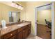 Bathroom with granite vanity and access to office at 465 Rowland Ct, Bartow, FL 33830