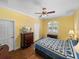 Comfortable bedroom with hardwood floors and TV at 465 Rowland Ct, Bartow, FL 33830