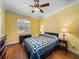 Bedroom with wood floors, ceiling fan, and window at 465 Rowland Ct, Bartow, FL 33830