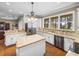 Kitchen with granite island, stainless steel appliances, and lake view at 465 Rowland Ct, Bartow, FL 33830