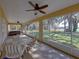 Relaxing screened porch with hot tub and lake view at 465 Rowland Ct, Bartow, FL 33830