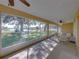 Serene screened porch with lake view and comfortable seating at 465 Rowland Ct, Bartow, FL 33830