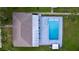 Aerial view of the backyard pool and patio, perfect for outdoor entertaining and relaxation at 470 Village Sw Cir, Winter Haven, FL 33880